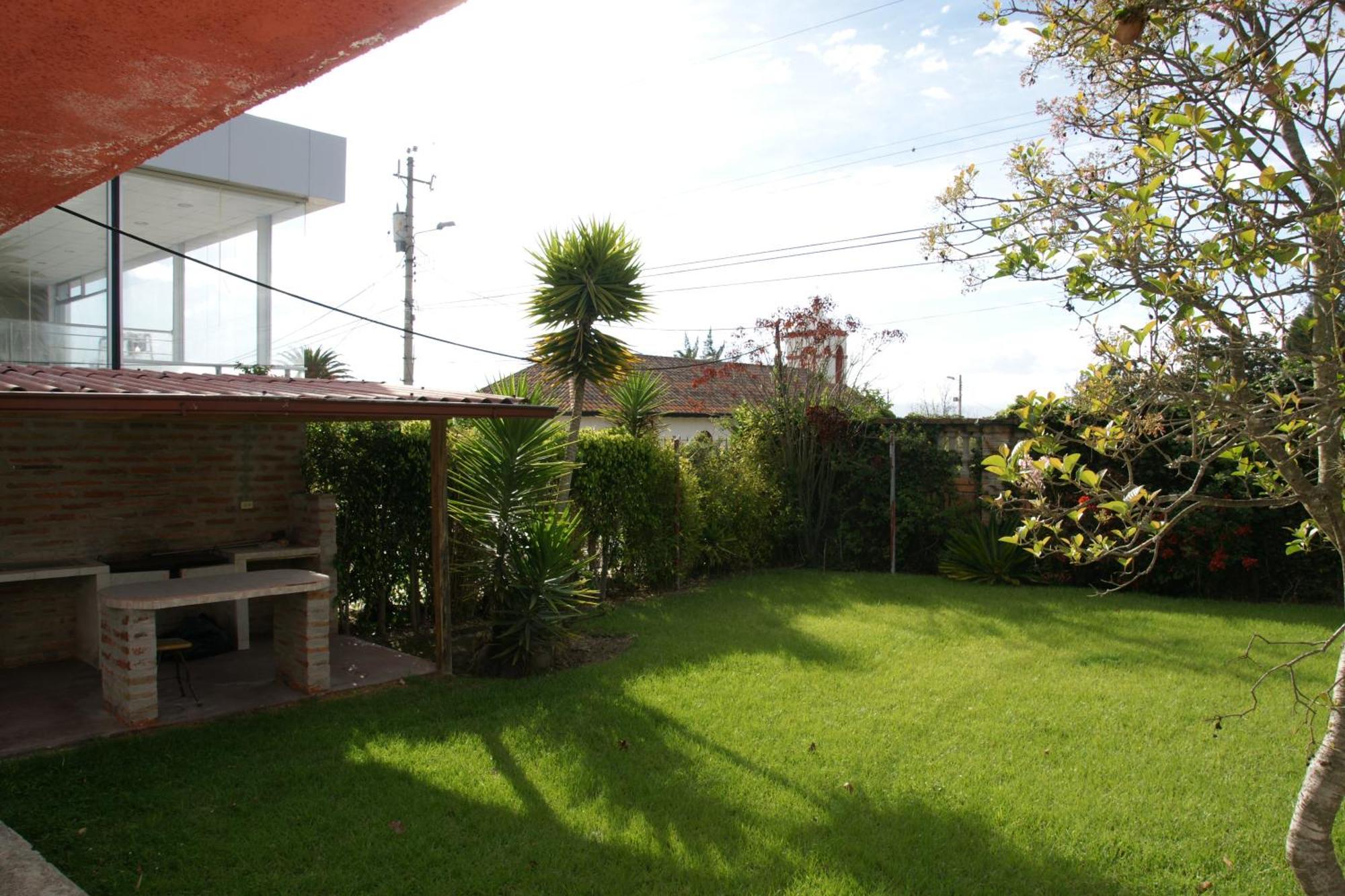 Hostal El Parque Tababela Rom bilde